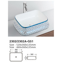 Colorful art basin installed on ceramic table